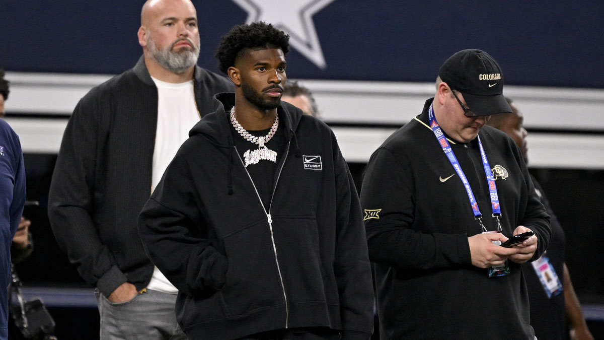 West quarterback Shedeur Sanders of Colorado (2) looks on from the sidelines during the first half against the East at AT&T Stadium