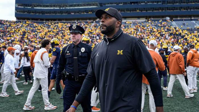 Michigan coach Sherrone Moore walks off the field after his team's 31-12 loss to Texas at Michigan Stadium