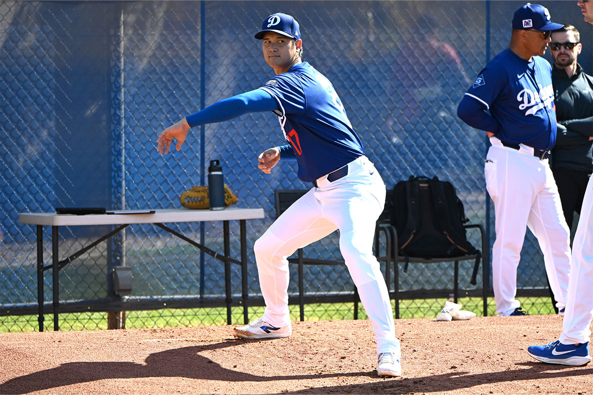 Los Angeles Dodgers two-way player Shohei Ohtani (17) works on his form during a spring training bullpen session at Camelback Ranch.