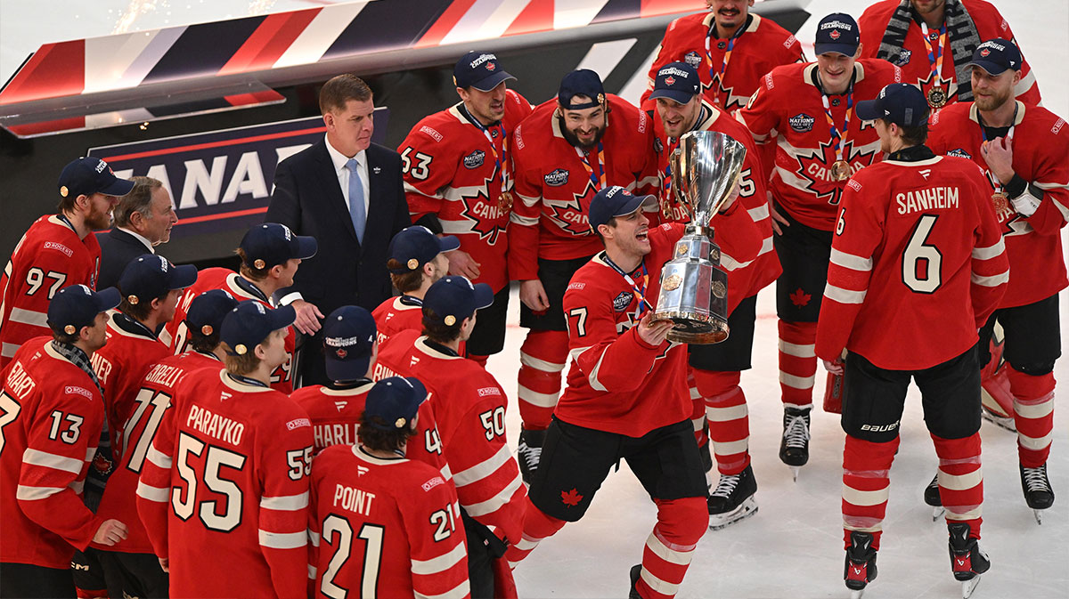 Team Canada forward Sidney Crosby (87) lifts the 4 Nations Face-Off trophy after winning against Team USA in overtime during the 4 Nations Face-Off ice hockey championship game at TD Garden.