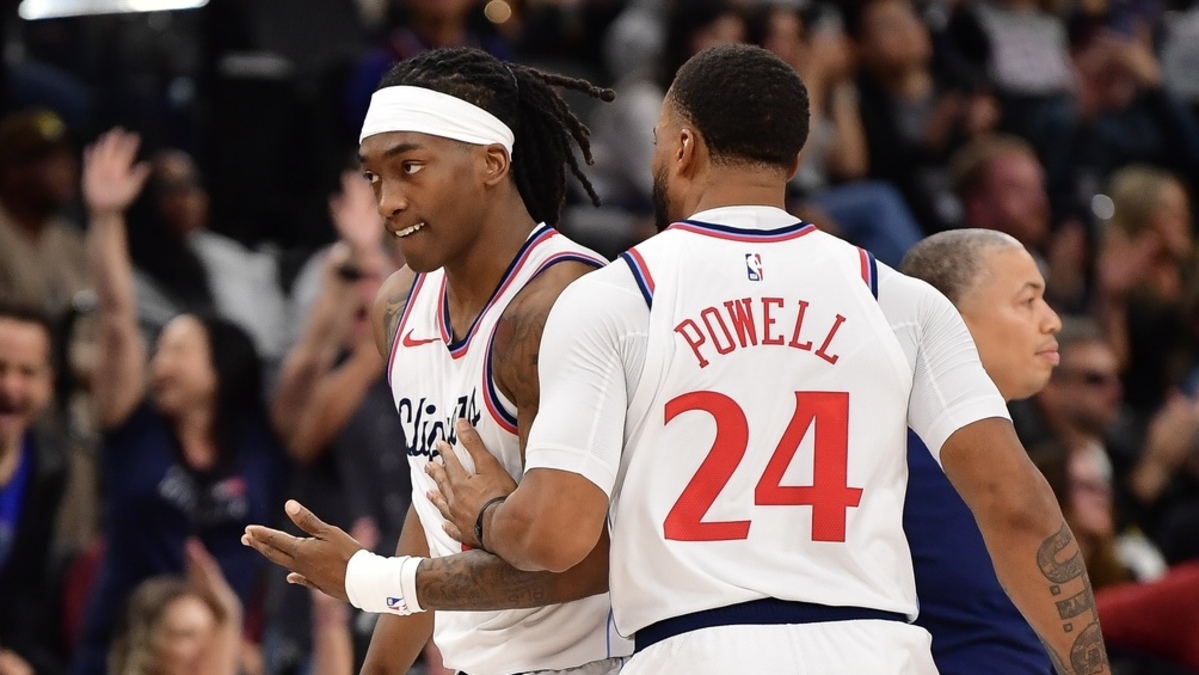 Los Angeles Clippers guard Terance Mann (14) reacts after scoring three point basket against the Denver Nuggets with guard Norman Powell (24) during the second half at Intuit Dome.