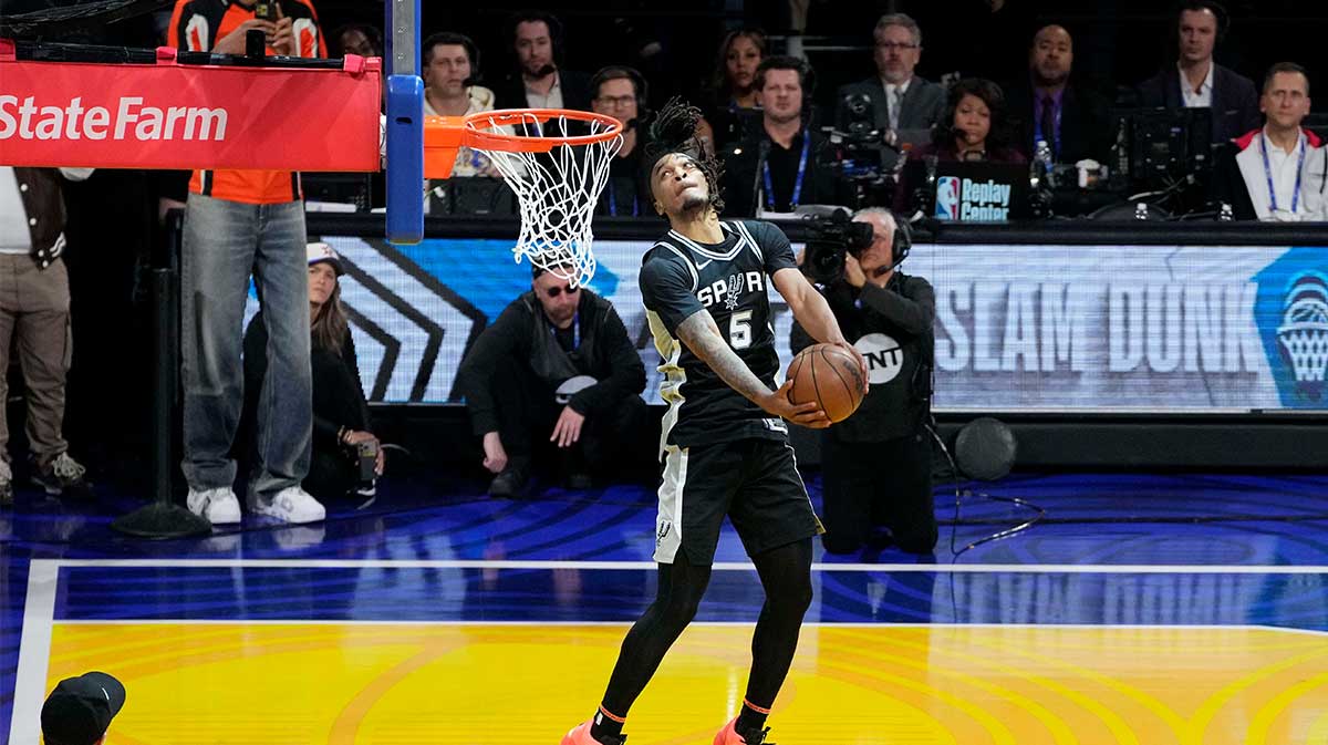 San Antonio Spurs forward Stephon Castle (5) competes in the slam dunk competition during All Star Saturday Night ahead of the 2025 NBA All Star Game at Chase Center. 