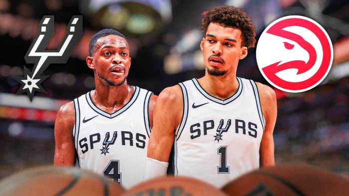 Spurs De'Aaron Fox and Victor Wembanyama next to a Hawks logo