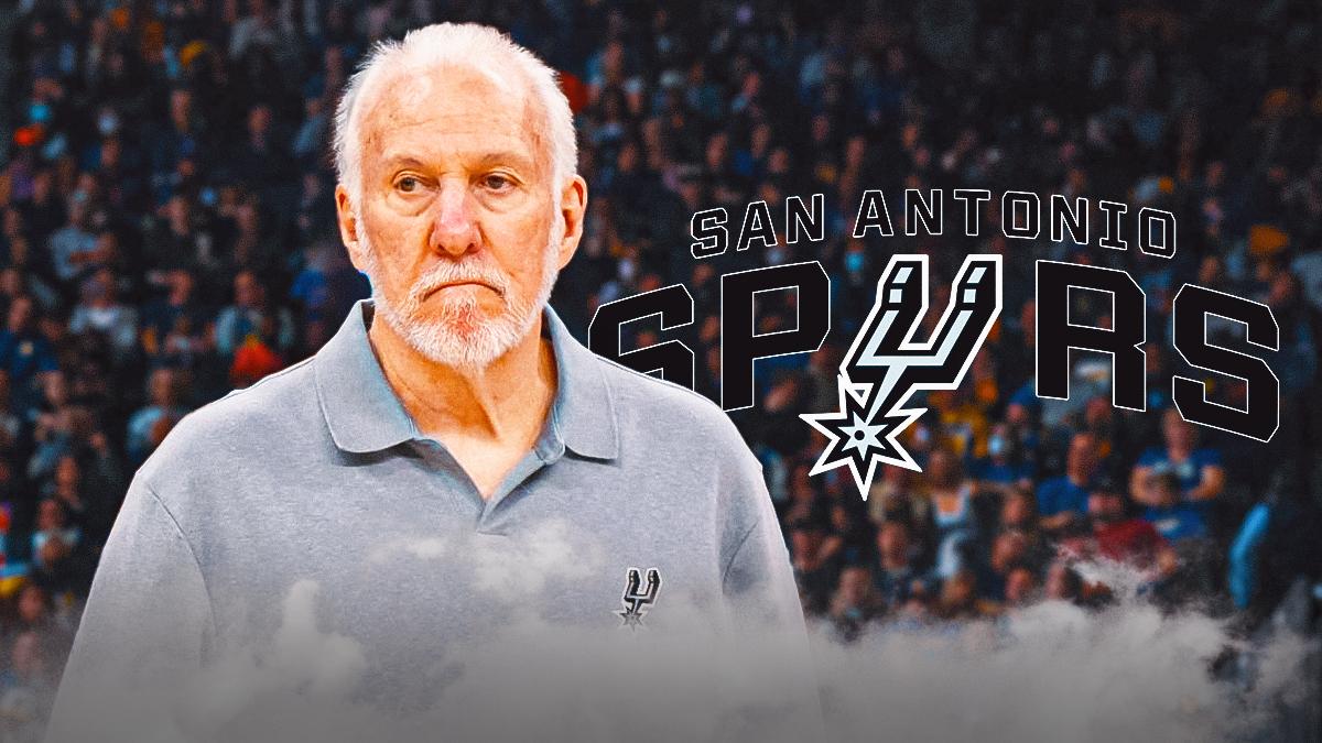 Gregg Popovich Spurs logo in the background.
