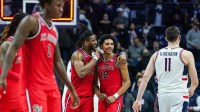 St. John's Red Storm forward Zuby Ejiofor (24) and guard RJ Luis Jr. (12) react after defeating the UConn Huskies in the second half at Harry A. Gampel Pavilion.