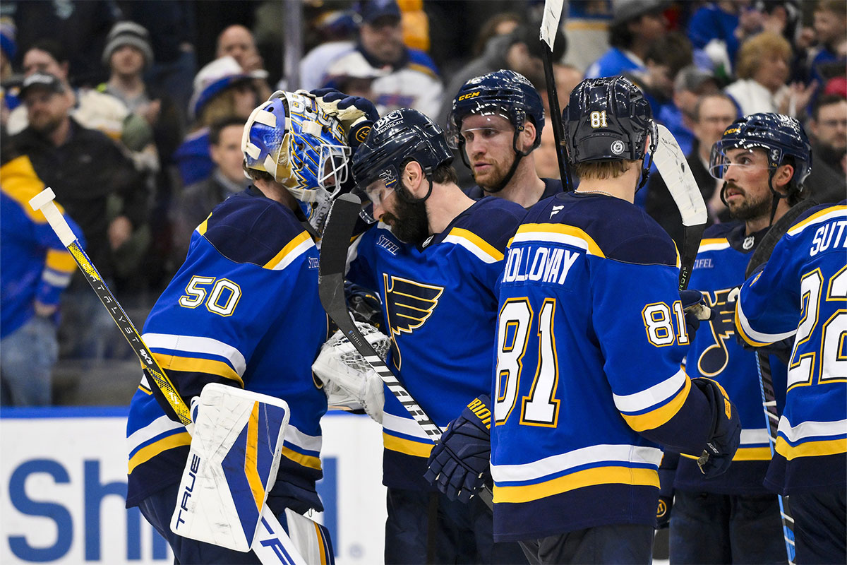 St. Louis Blues goaltender Jordan Binnington (50) celebrates with defenseman Nick Leddy (4) after the Blues defeated the Seattle Kraken at Enterprise Center.