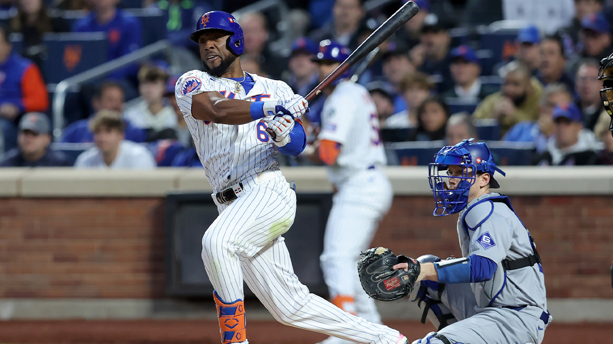 New York Mets right fielder Starling Marte (6) follows through on a two run double against the Los Angeles Dodgers during the third inning of game five of the NLCS during the 2024 MLB playoffs at Citi Field.