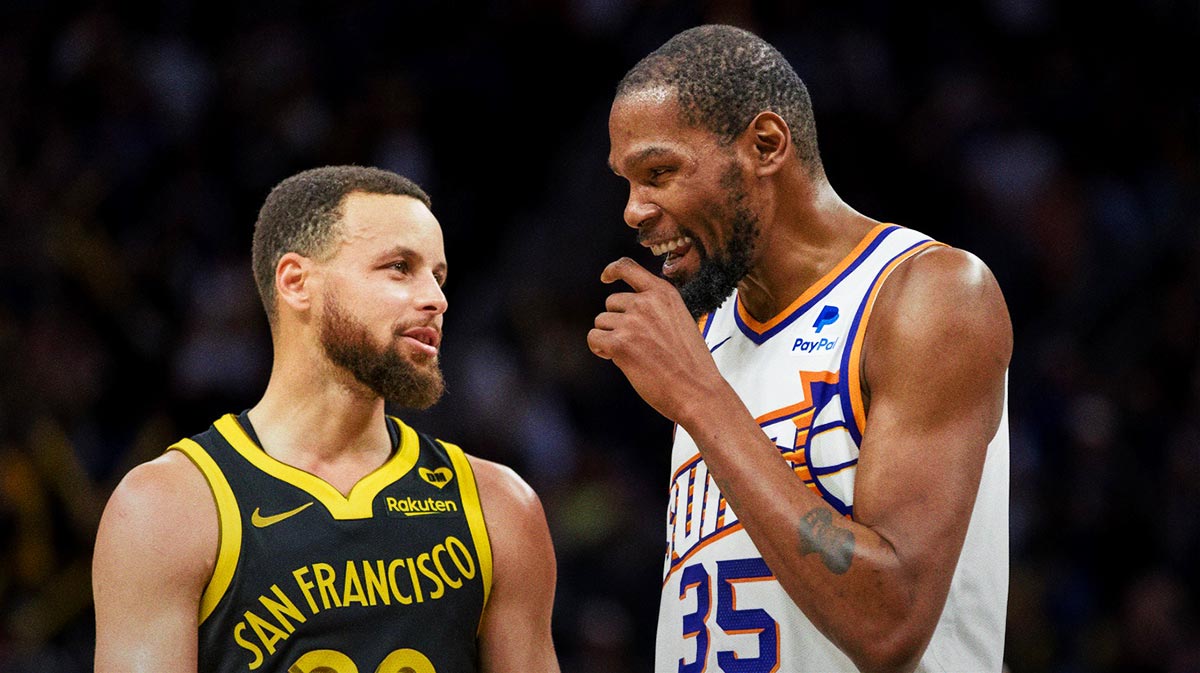 The golden state warriors preserve Stephen Curri (30) and Phoenix Suns forward, Kevin Durant (35) talk during the second half in Chase Center.