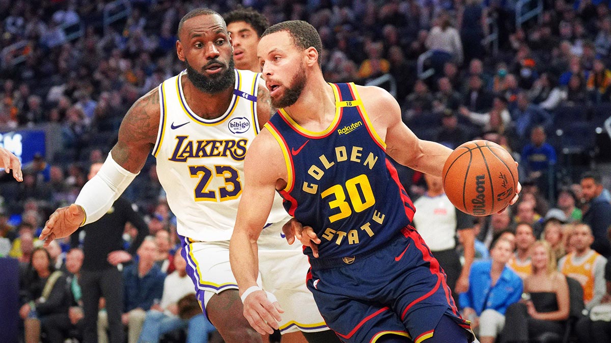 Gold state warriors preserve Stephen Curri (30) Dribbles against Los Angeles Lekers Lebron James (23) during the third quarter at Chase Center.