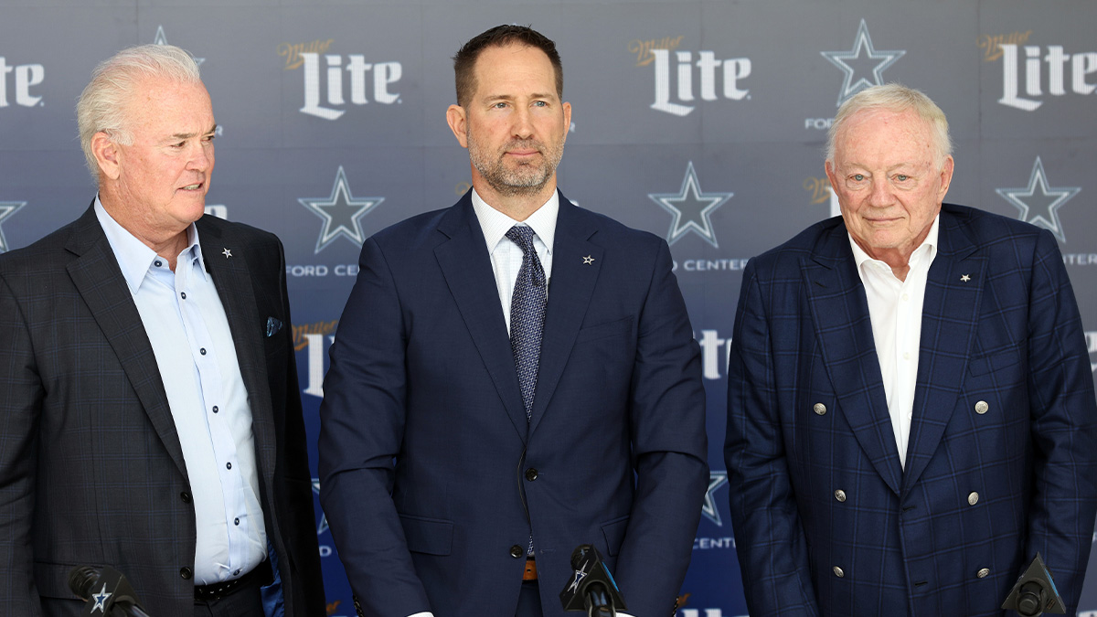 Dallas Cowboys CEO Stephen Jones,head coach Brian Schottenheimer and owner Jerry Jones pose for pictures after a press conference at the Star.