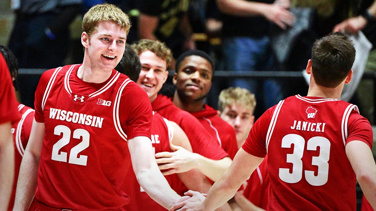Wisconsin Badgers forward Steven Crowl (22) shakes hands with guard Jack Janicki (33) after defeating the Purdue Boilermakers at Mackey Arena.