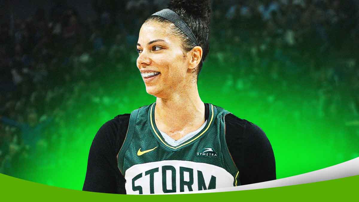 WNBA player Alysha Clark with a jersey swap so she is ina Seattle Storm jersey