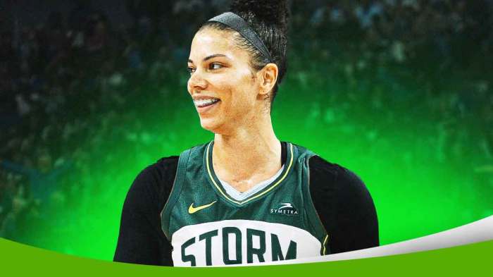 WNBA player Alysha Clark with a jersey swap so she is ina Seattle Storm jersey