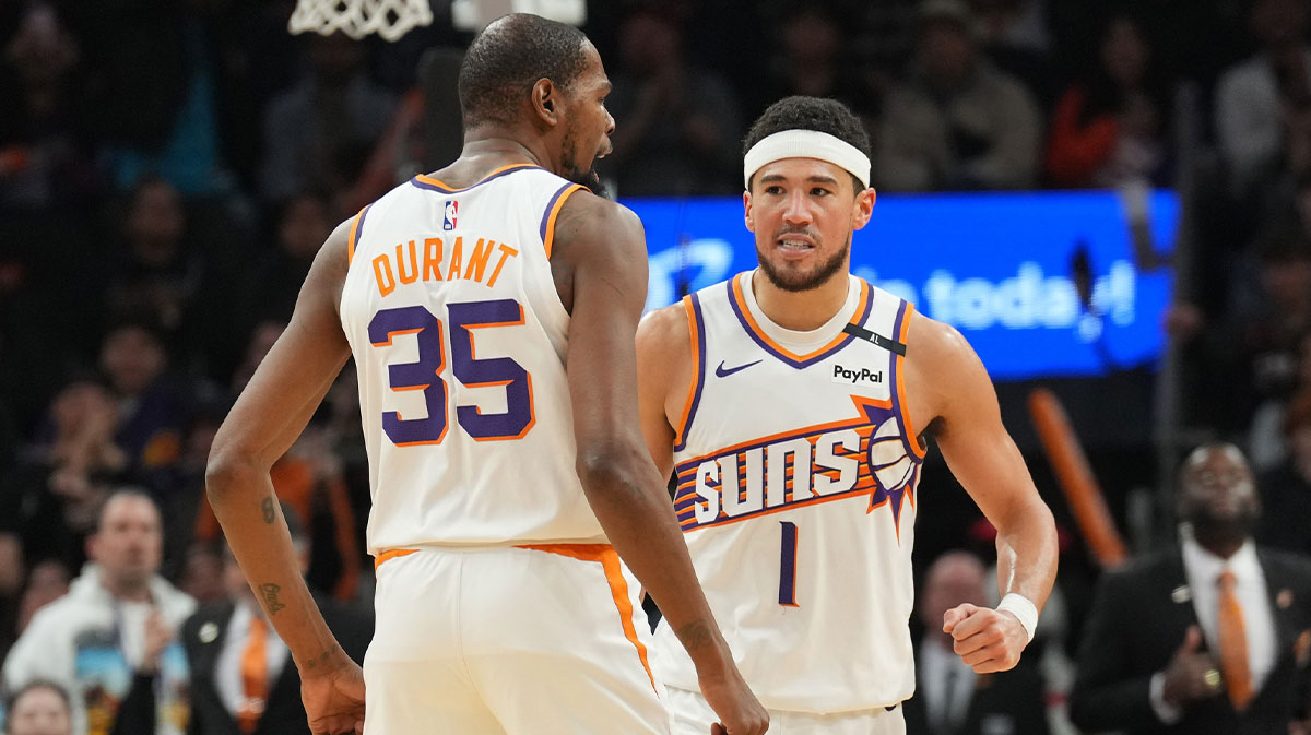 Phoenix Suns forward Kevin Durant (35) and Phoenix Suns guard Devin Booker (1) celebrate against the LA Clippers during the second half at Footprint Center. 