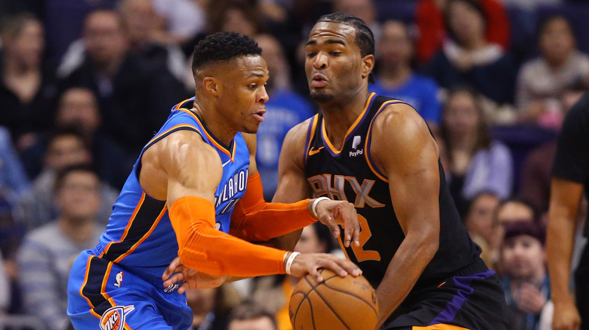 Oklahoma City Thunder guard Russell Westbrook (0) against Phoenix Suns forward TJ Warren (12) at Talking Stick Resort Arena.