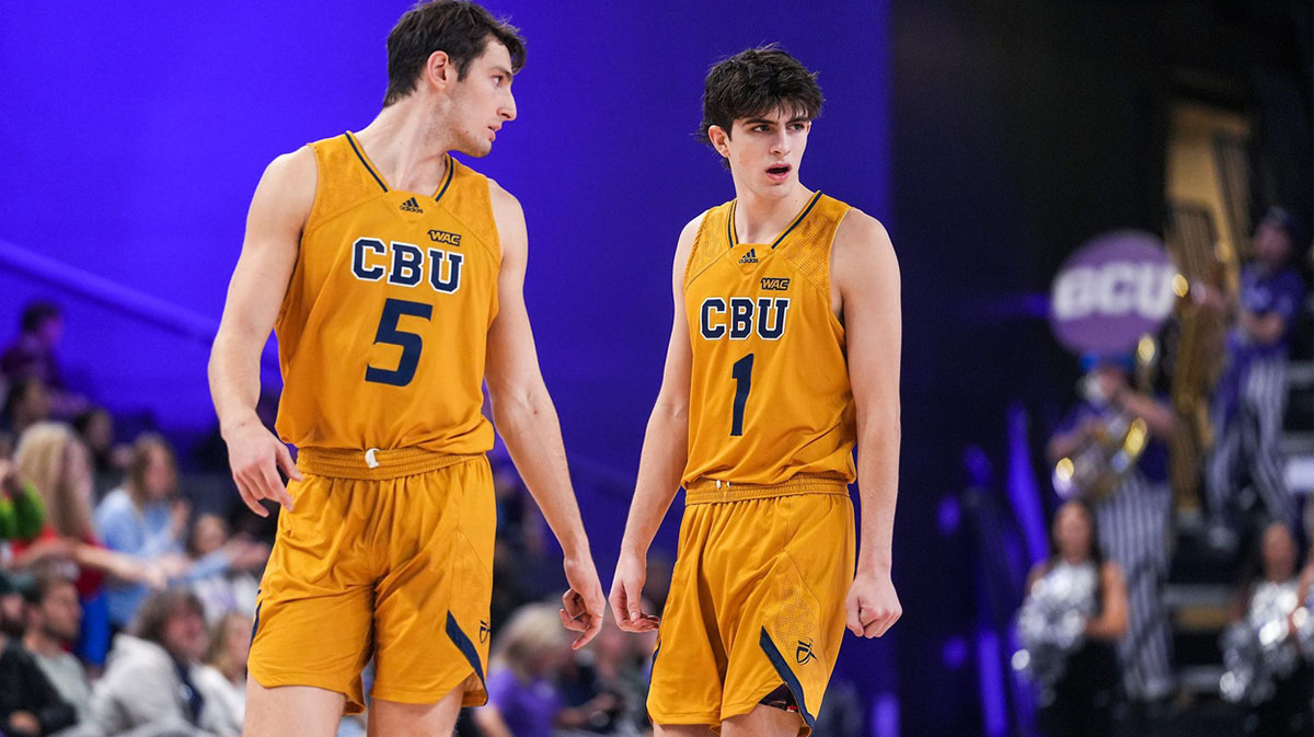 California Baptist Lancers guard Reed Nottage (5), left, and California Baptist Lancers guard Taran Armstrong (1), right, talk as their team is down during the closing minutes of the second half against the California Baptist Lancers at GCU Arena on Saturday, Feb. 5, 2022, in Phoenix.