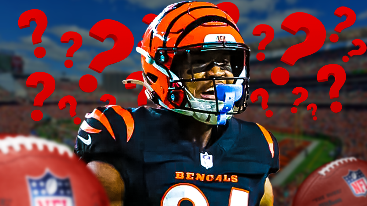 Tee Higgins, Bengals, Tee Higgins free agency, Tee Higgins rumors, Tee Higgins Bengals, Tee Higgins with a few question marks around him, Bengals stadium in the background