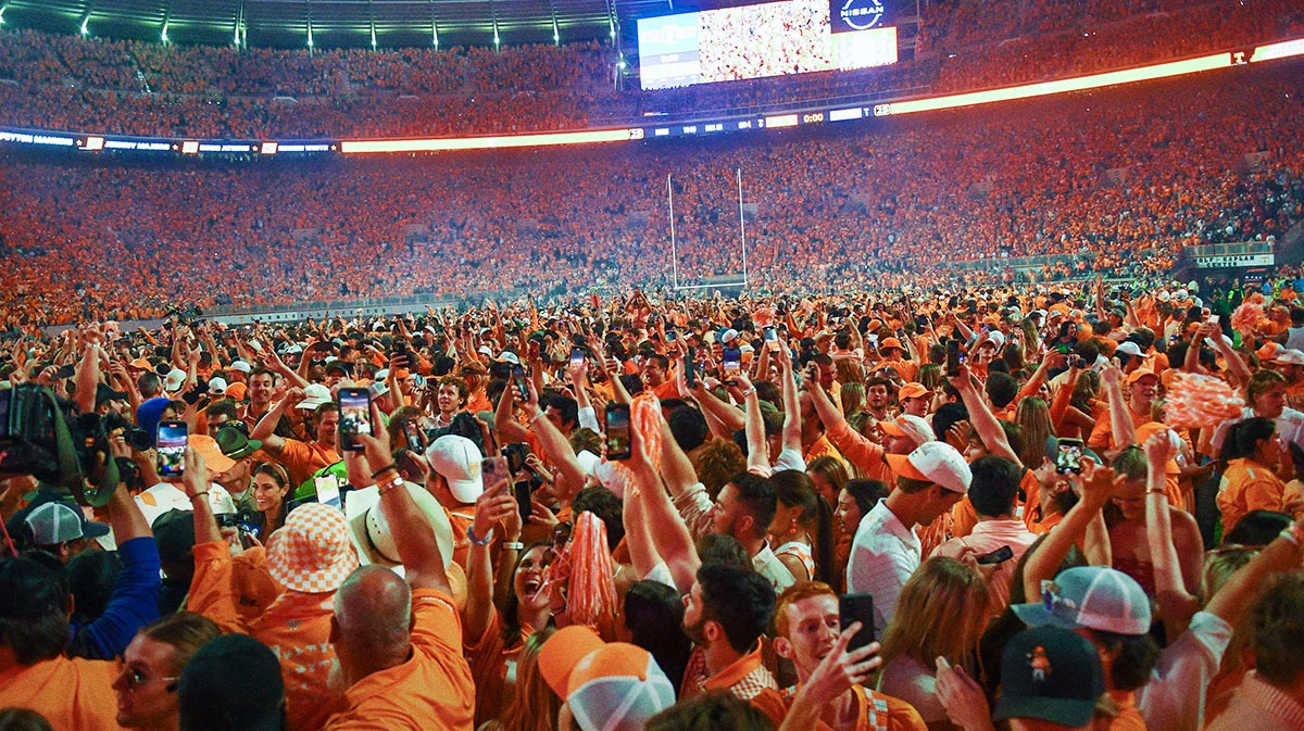 Fans storm the field after Tennessee's 52-49 win over Alabama in Neyland Stadium