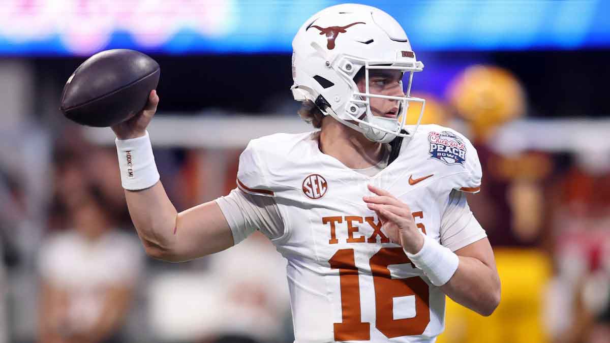 Texas Longhorns quarterback Arch Manning (16) warms up before the Peach Bowl at Mercedes-Benz Stadium. 