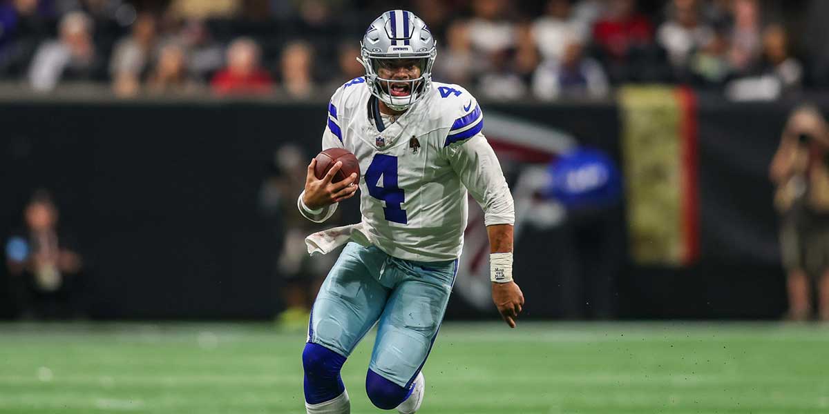 Dallas Cowboys quarterback Dak Prescott (4) scrambles against the Atlanta Falcons in the third quarter at Mercedes-Benz Stadium.