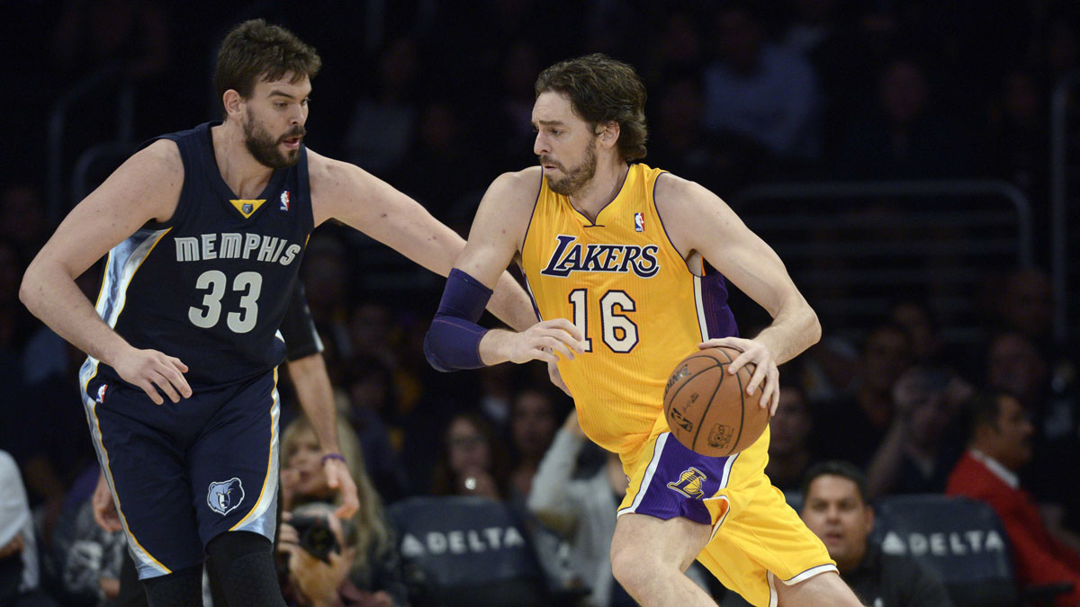 Los Angeles Lakers center Pau Gasol (16) handles the ball defended by Memphis Grizzlies center Marc Gasol (33) during the first quarter at Staples Center.