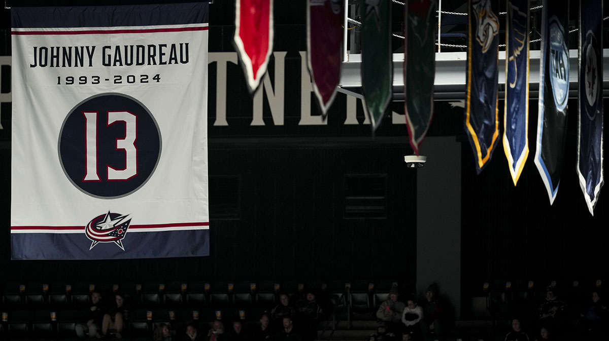 A banner honoring the late Johnny Gaudreau is seen in the rafters before the game between the Calgary Flames and the Columbus Blue Jackets at Nationwide Arena