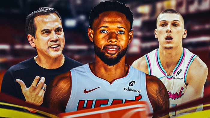 Miami Heat star Haywood Highsmith in the center with Erik Spoelstra and Tyler Herro on either side in front of Kaseya Center.