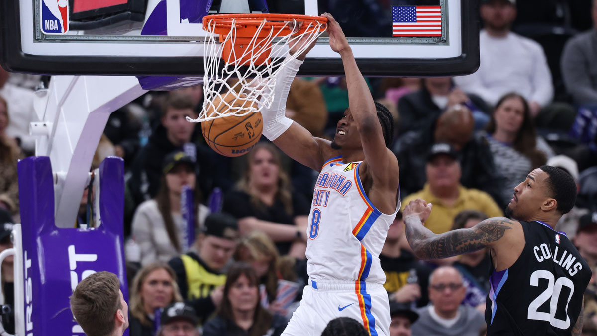 Thunder forward Jalen Williams (8) Dunks as Utah Jazz forward, John Collins (20) Defend during the fourth quarter in Delta Centura