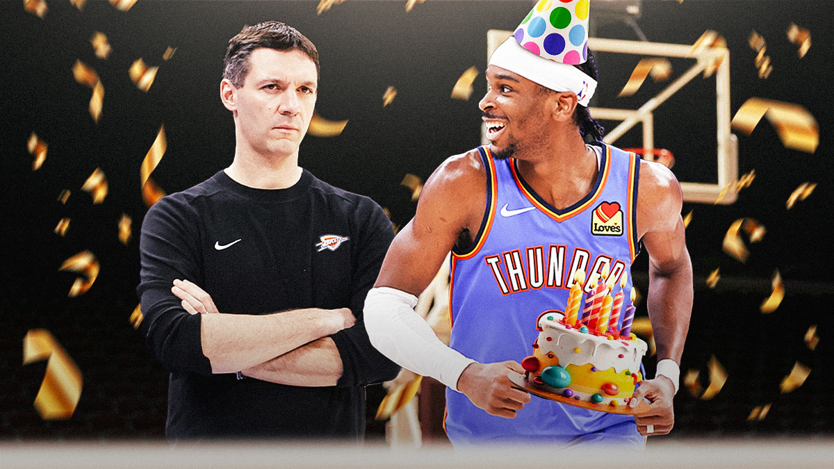 Thunder's Shai Gilgeous-Alexander smiling while holding a birthday cake and wearing a party hat while looking at Mark Daigneault
