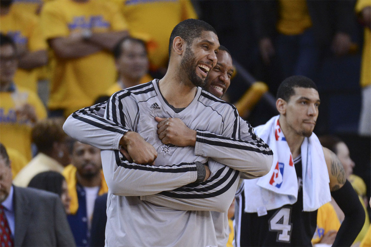 San Antonio Spurs shooting guard Tracy McGrady (1, back) hugs power forward Tim Duncan (21, front) during the fourth quarter in game six of the second round of the 2013 NBA Playoffs against the Golden State Warriors at Oracle Arena. The Spurs defeated the Warriors 94-82.