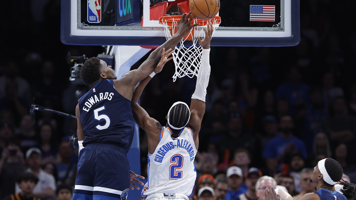 Minnesota Timberwolves guard Anthony Edwards (5) blocks a shot by Oklahoma City Thunder guard Shai Gilgeous-Alexander (2) during the second half at Paycom Center. 