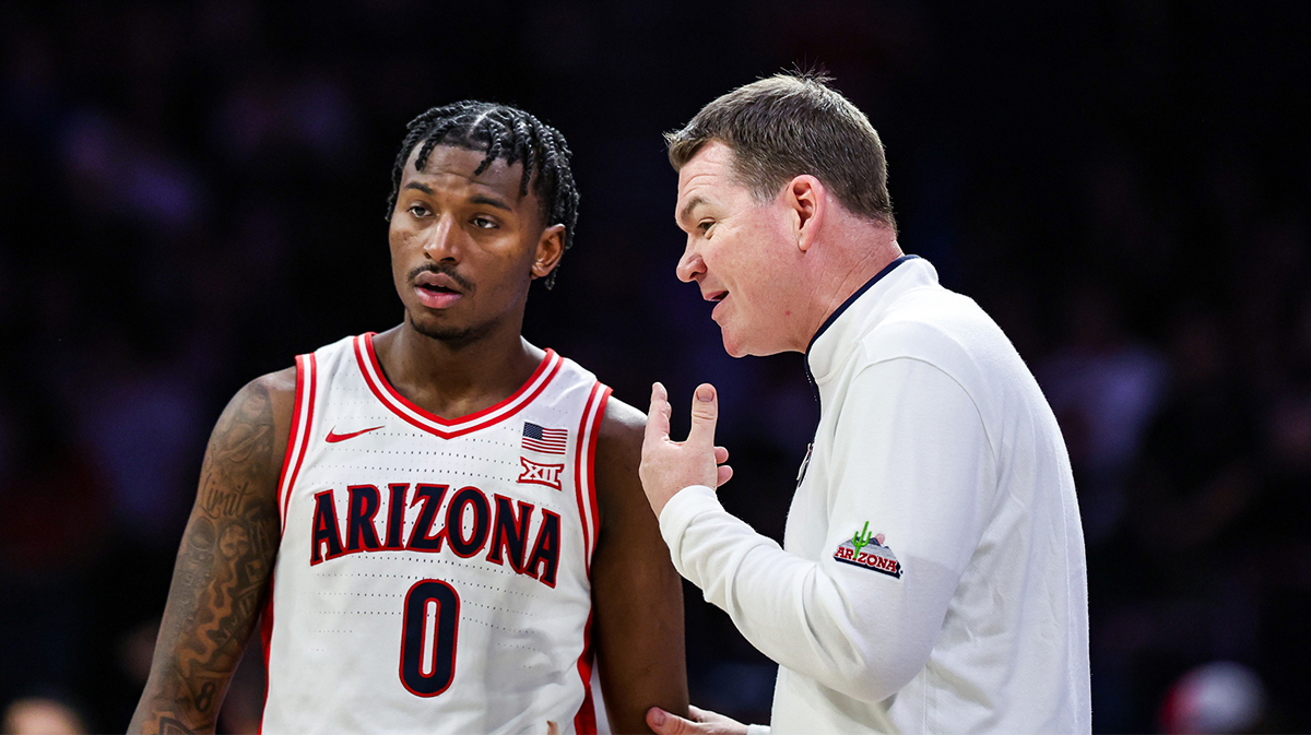 Arizona Wildcats head coach Tommy Lloyd talks with guard Jaden Bradley (0) during the second half against the Utah Utes at McKale Center.