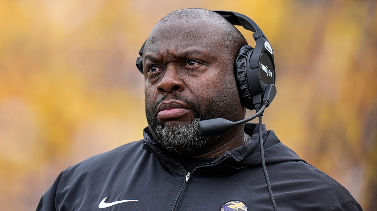 Michigan running back coach Tony Alford watches a play against Texas during the first half at Michigan Stadium