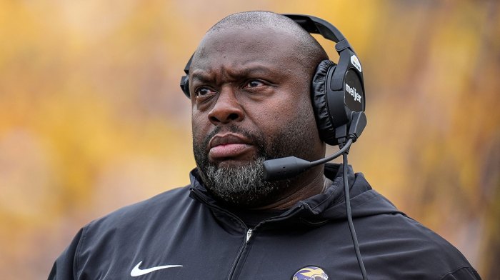 Michigan running back coach Tony Alford watches a play against Texas during the first half at Michigan Stadium