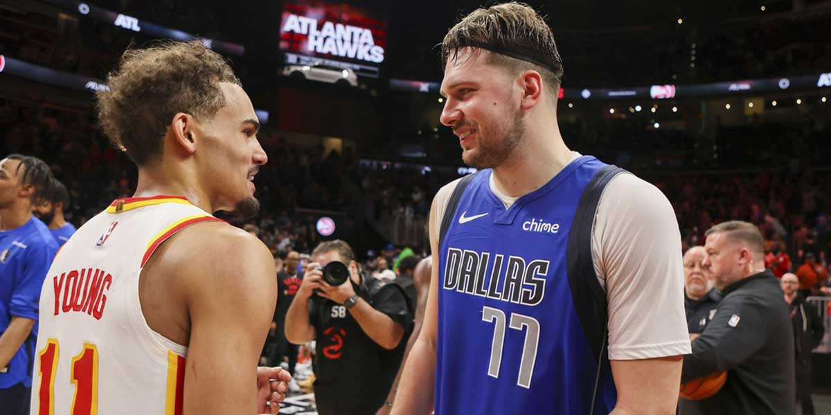 Atlanta Hawks Guard Trae Young (11) Talks with Dallas Mavericks Guard Luke Doncic (77) After the game on the State Farm Arena. 