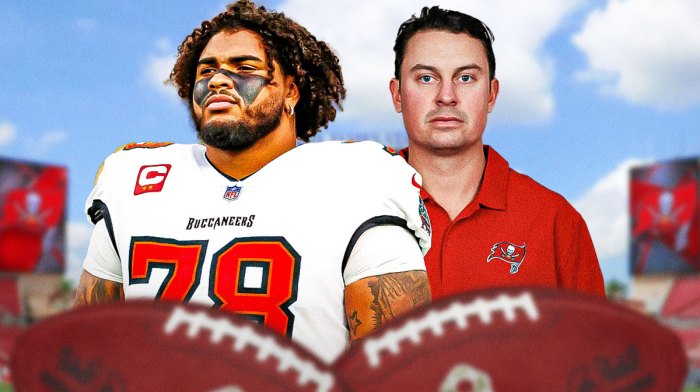 Tampa Bay Buccaneers star Tristan Wirfs and Josh Grizzard in front of Raymond James Stadium.