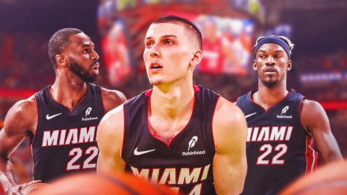 Miami Heat star Tyler Herro in the middle with Andrew Wiggins and Jimmy Butler on either side in front of Kaseya Center.