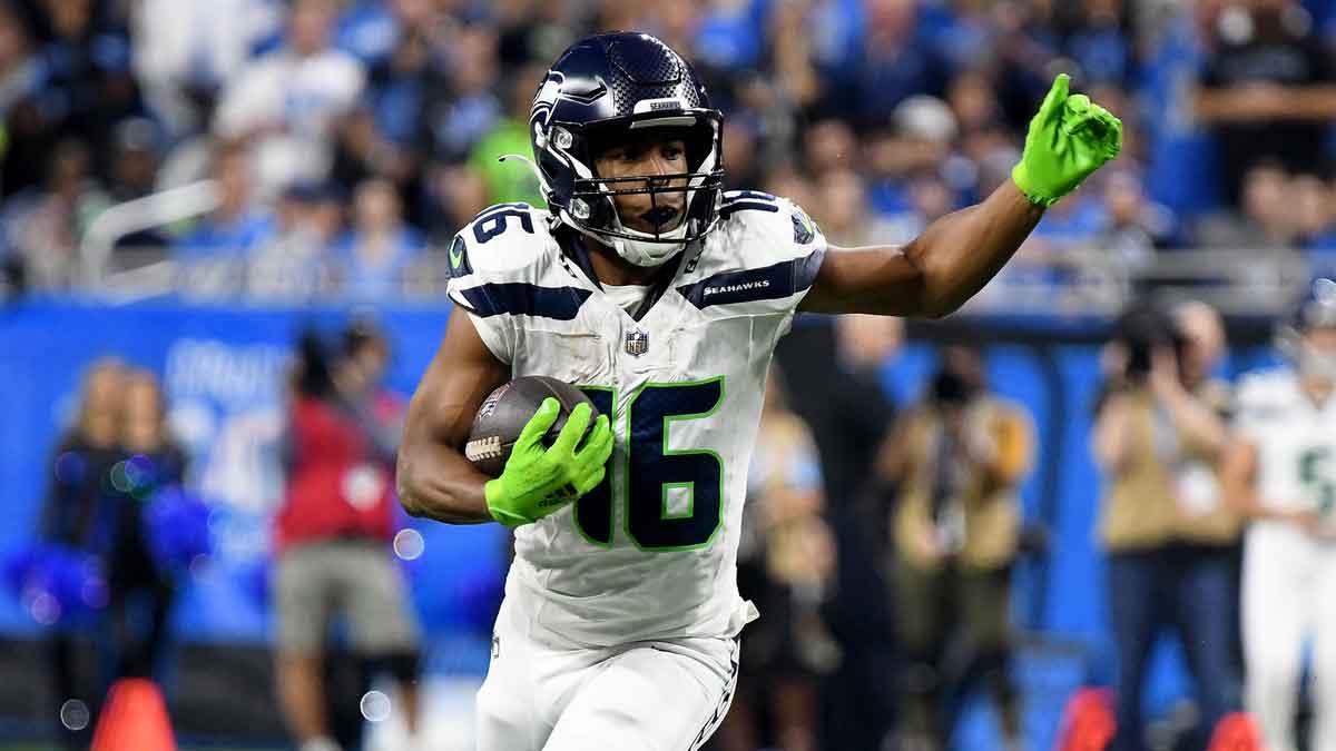 Sep 30, 2024; Detroit, Michigan, USA; Seattle Seahawks wide receiver Tyler Lockett (16) runs the ball against the Detroit Lions in the third quarter at Ford Field. 