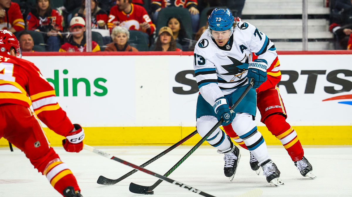 San Jose Sharks center Tyler Toffoli (73) controls the puck against the Calgary Flames during the third period at Scotiabank Saddledome.