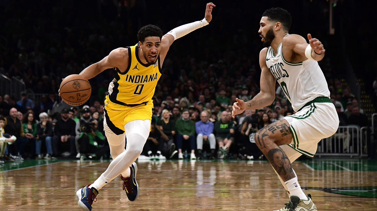 Indiana Pacers guard Tyrese Haliburton (0) controls the ball while Boston Celtics forward Jayson Tatum (0) defends during the second half at TD Garden.