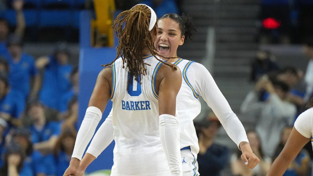 UCLA Bruins forward Timea Gardiner (30) and forward Janiah Barker (0) celebrate in the fourth quarter against the Michigan State Spartans.