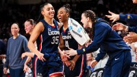 Feb 16, 2025; Columbia, South Carolina, USA; UConn Huskies guard Azzi Fudd (35) is congratulated after being pulled from the game against the South Carolina Gamecocks in the second half at Colonial Life Arena. Mandatory Credit: Jeff Blake-Imagn Images