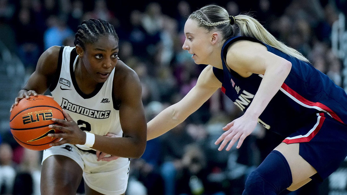 Friar guard Grace Efosa goes one on one against UConn women's basketball defender Paige Bueckers in the first half.