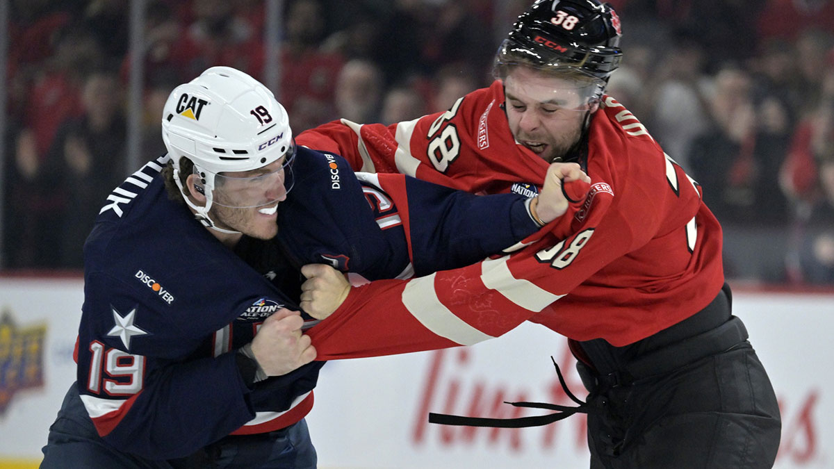 Team United States forward Matthew Tkachuk (19) and Team Canada forward brandon Hagel (38) fight in the first period during a 4 Nations Face-Off ice hockey game at the Bell Centre.