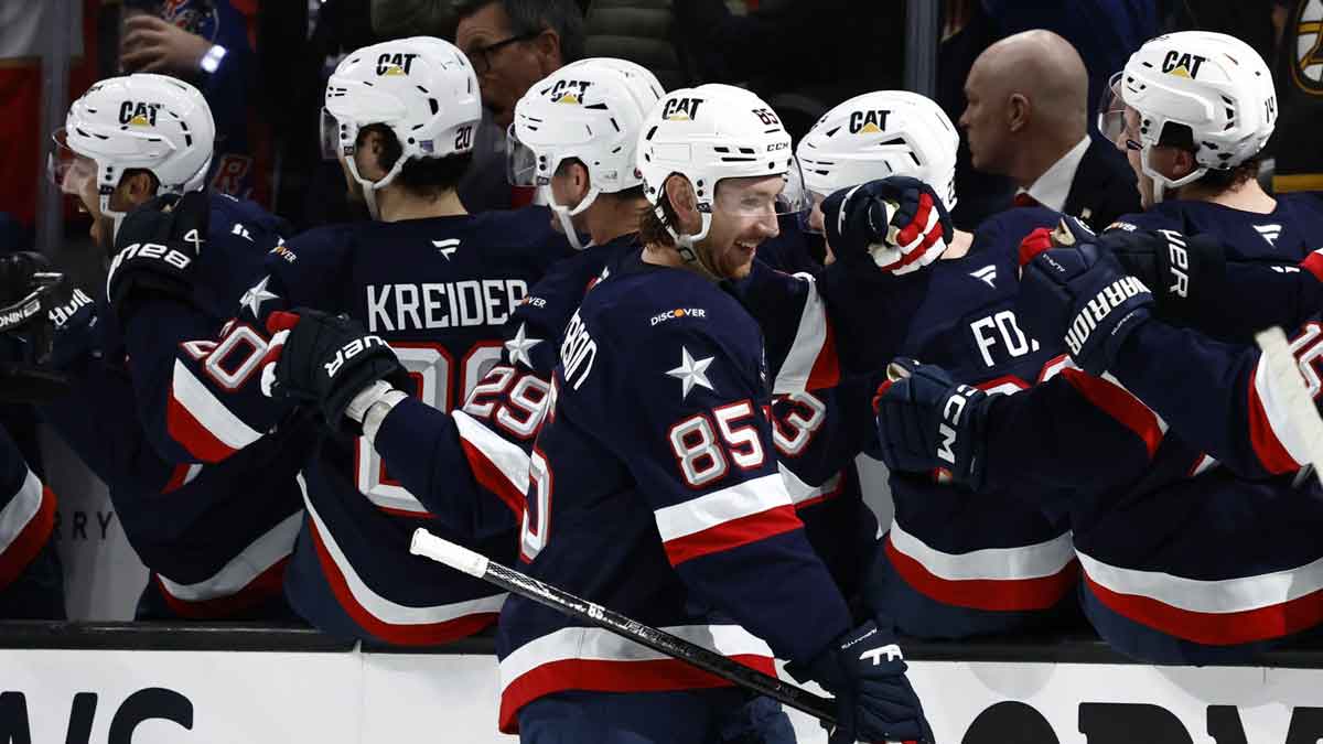 Team Canada forward Connor McDavid (97) controls the puck against Team USA defenseman Jaccob Slavin (74) during the second period during the 4 Nations Face-Off ice hockey championship game at TD Garden.