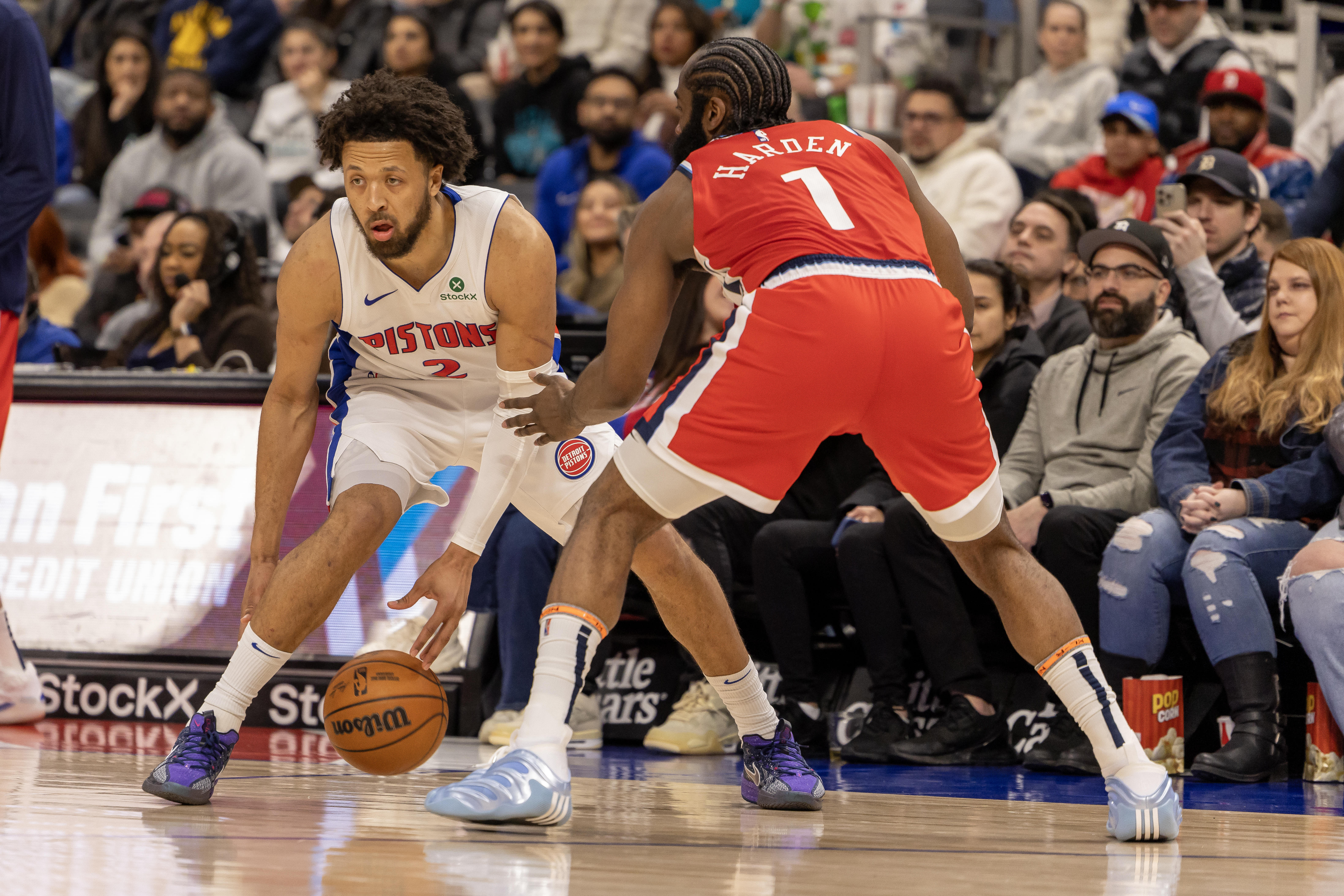 LA Clippers guard James Harden (1) defends against Detroit Pistons guard Cade Cunningham (2) during the first half at Little Caesars Arena. 