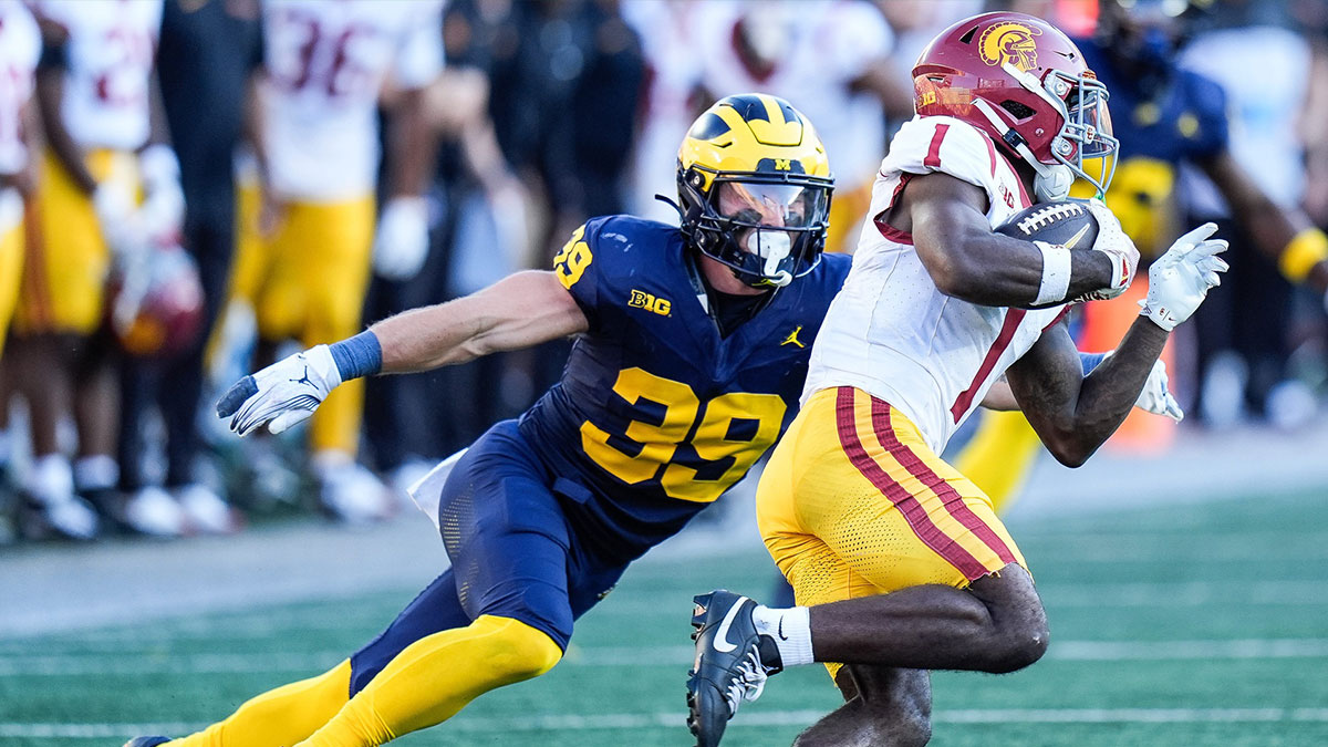 Michigan linebacker Jack MacKinnon (39) tackles USC wide receiver Zachariah Branch (1) during the second half at Michigan Stadium in Ann Arbor on Saturday, Sept. 21, 2024.