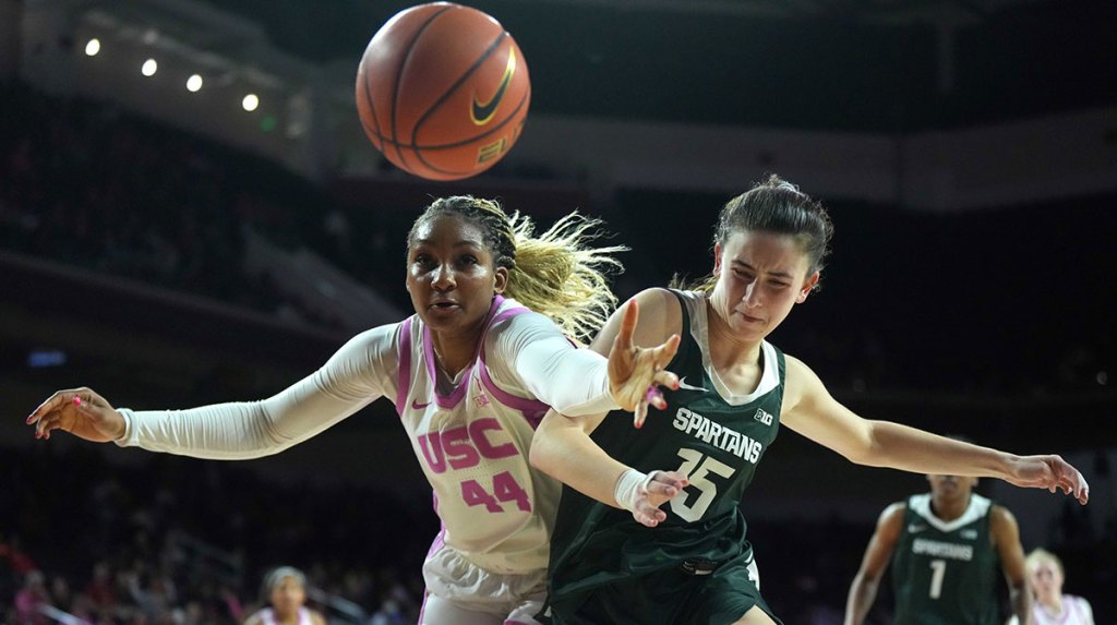 Southern California Trojans forward Kiki Iriafen (44) and Michigan State Spartans center Ines Sotelo (15) battle for the ball in the first half at Galen Center.