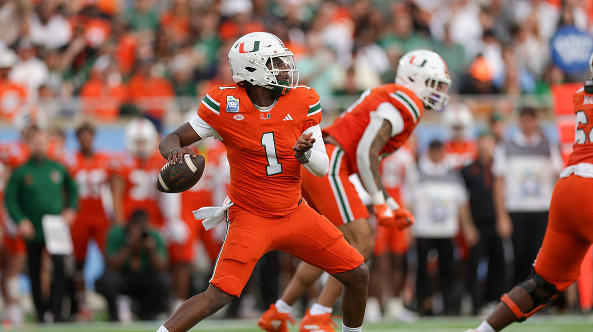 Miami Hurricanes quarterback Cam Ward (1) drops back to pass against the Iowa State Cyclones in the first quarter during the Pop Tarts bowl at Camping World Stadium. Jets