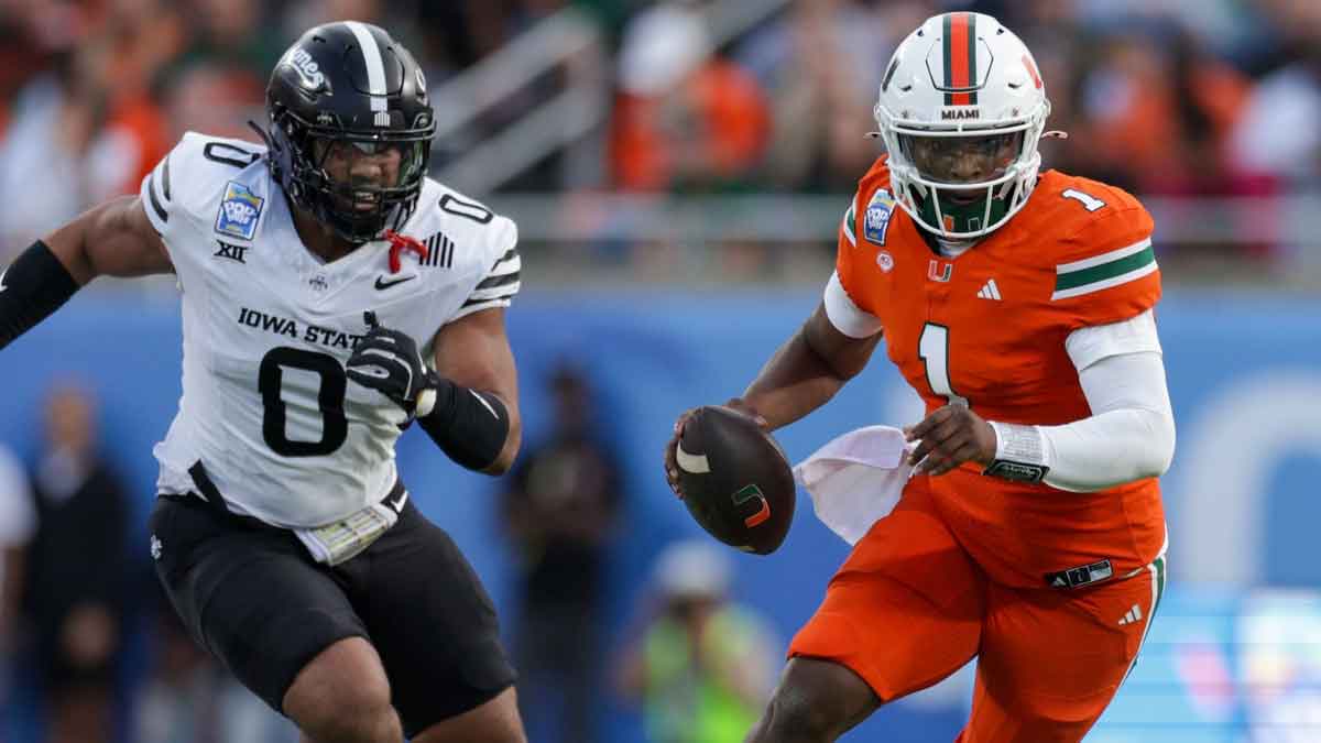 Miami Hurricanes quarterback Cam Ward (1) runs with the ball against the Iowa State Cyclones in the second quarter during the Pop Tarts bowl at Camping World Stadium.